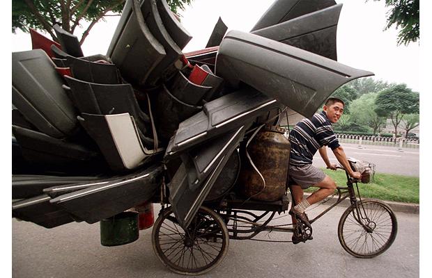 tricycle carrying car pieces